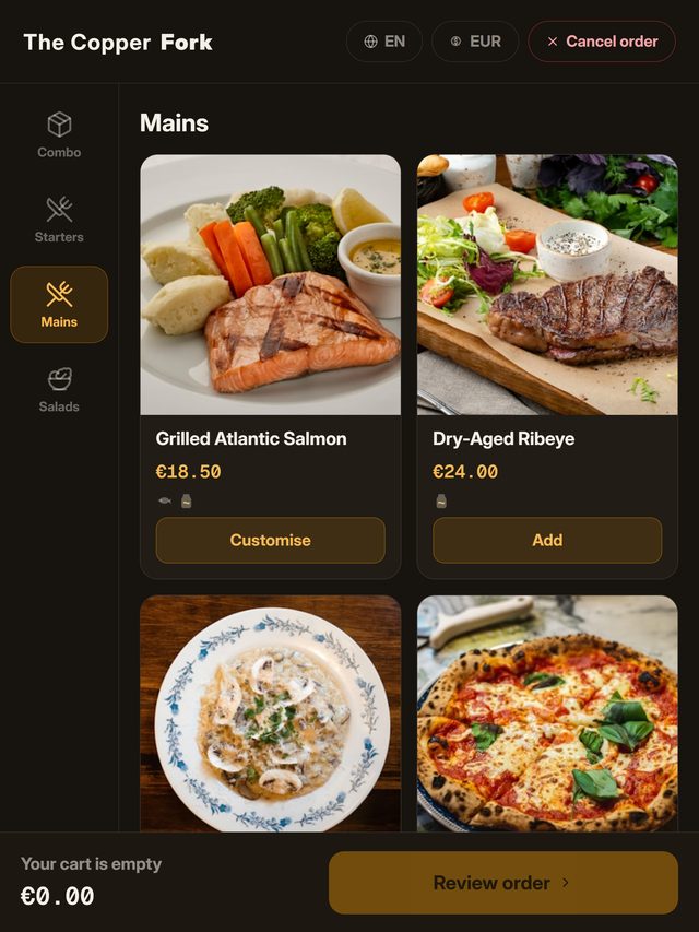 A self-order kiosk screen showing the mains category with dish photographs, prices in euros and an add button on each
