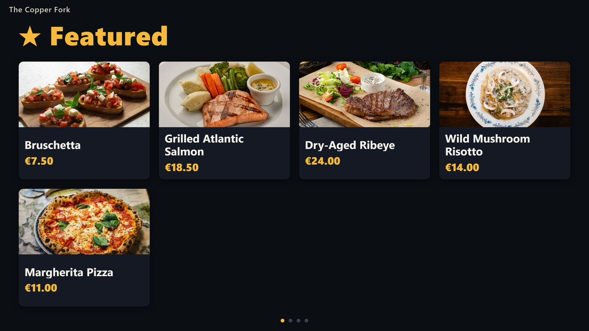 A wall screen showing the featured dishes with their photographs and prices, rotating through the menu